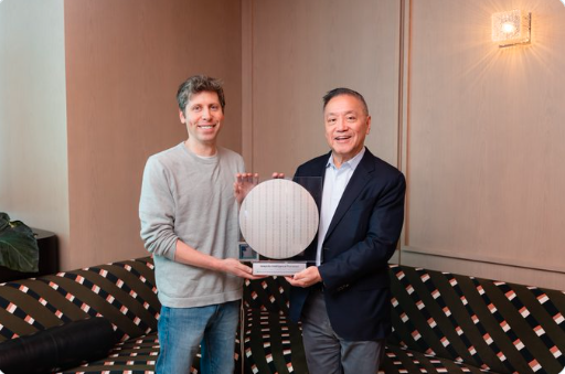 Broadcom ceo hock tan presenting a silicon chip wafer to openai ceo sam altman.